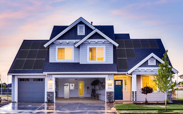 A residential home with the lights on